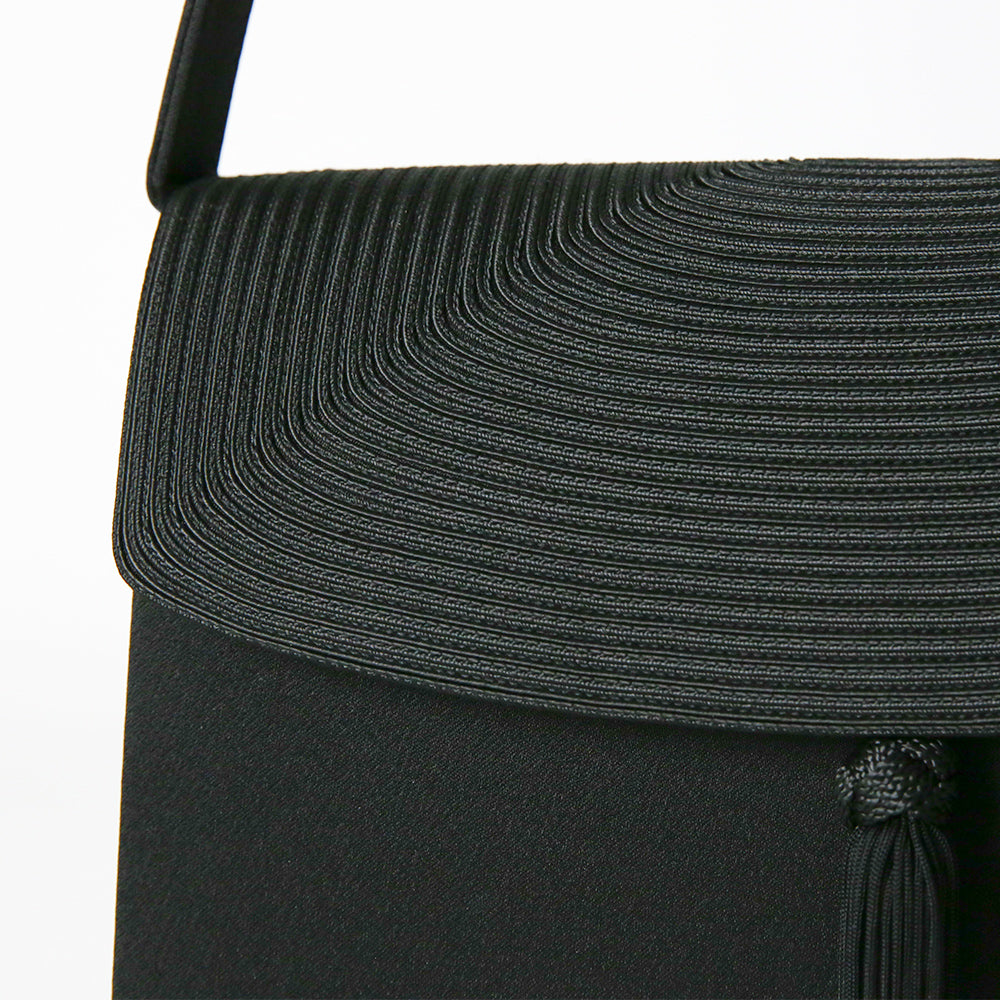 Cord embroidered formal bag with removable tassel