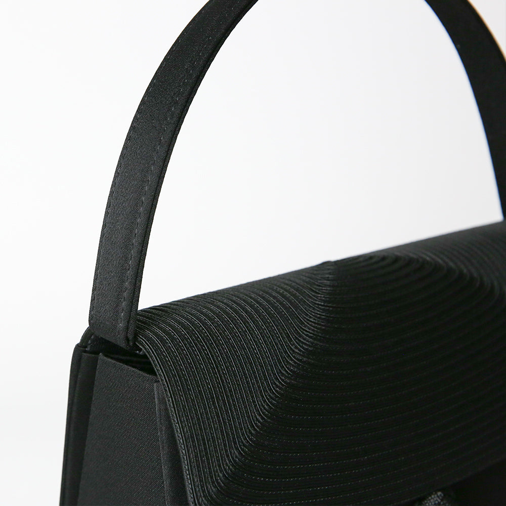 Cord embroidered formal bag with removable tassel