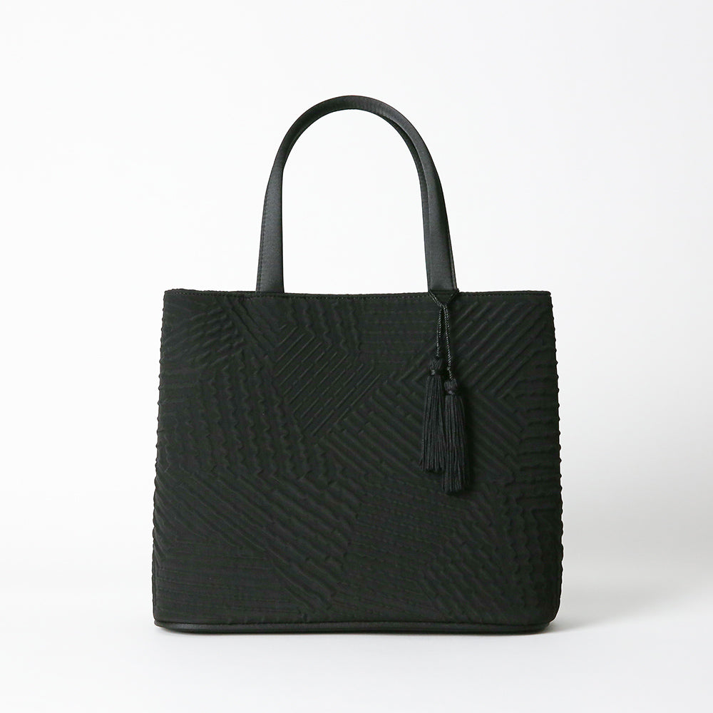 タッセル付きジオメトリック二層式バッグ