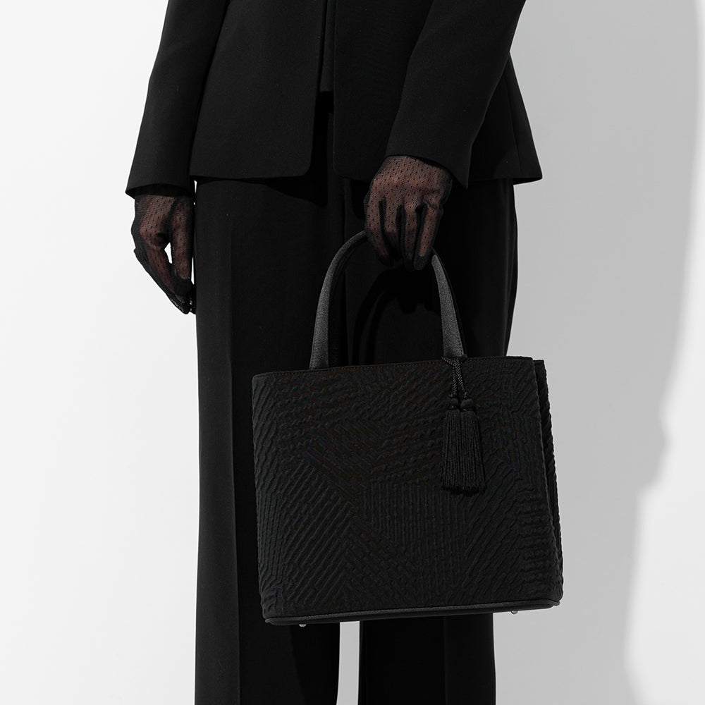 タッセル付きジオメトリック二層式バッグ