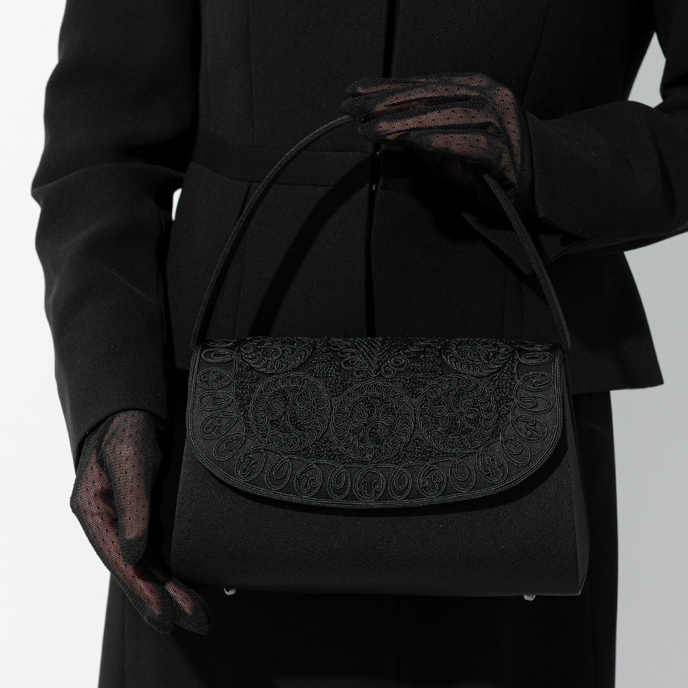 Formal bag with cord embroidery