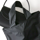 Durable water-repellent ``talisman'' handbag that can be carried over the shoulder