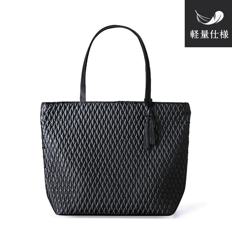 Quilted handbag L with tassel