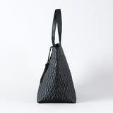 Quilted handbag with tassels M